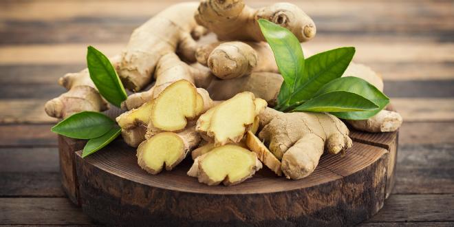 a platter of sliced and whole ginger root